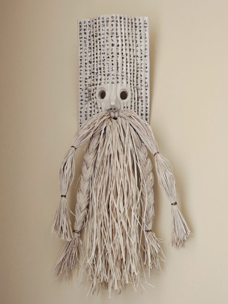 Pseftes - The Liar. Glazed ceramic, engobe, raffia fibre, cotton rope. 70x30x15 cm (2026)